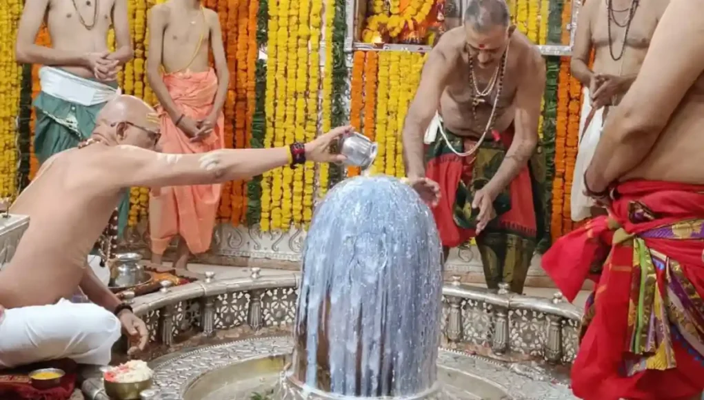 Pilgrims at Mahakaleshwar Temple in Ujjain — The City of Divinity and Eternal Faith offering prayers on the banks of the sacred River Shipra at sunrise.